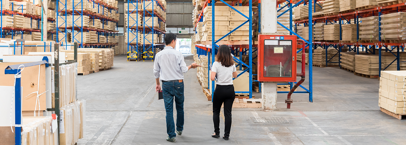 Kuna Foods warehouse with two team members.