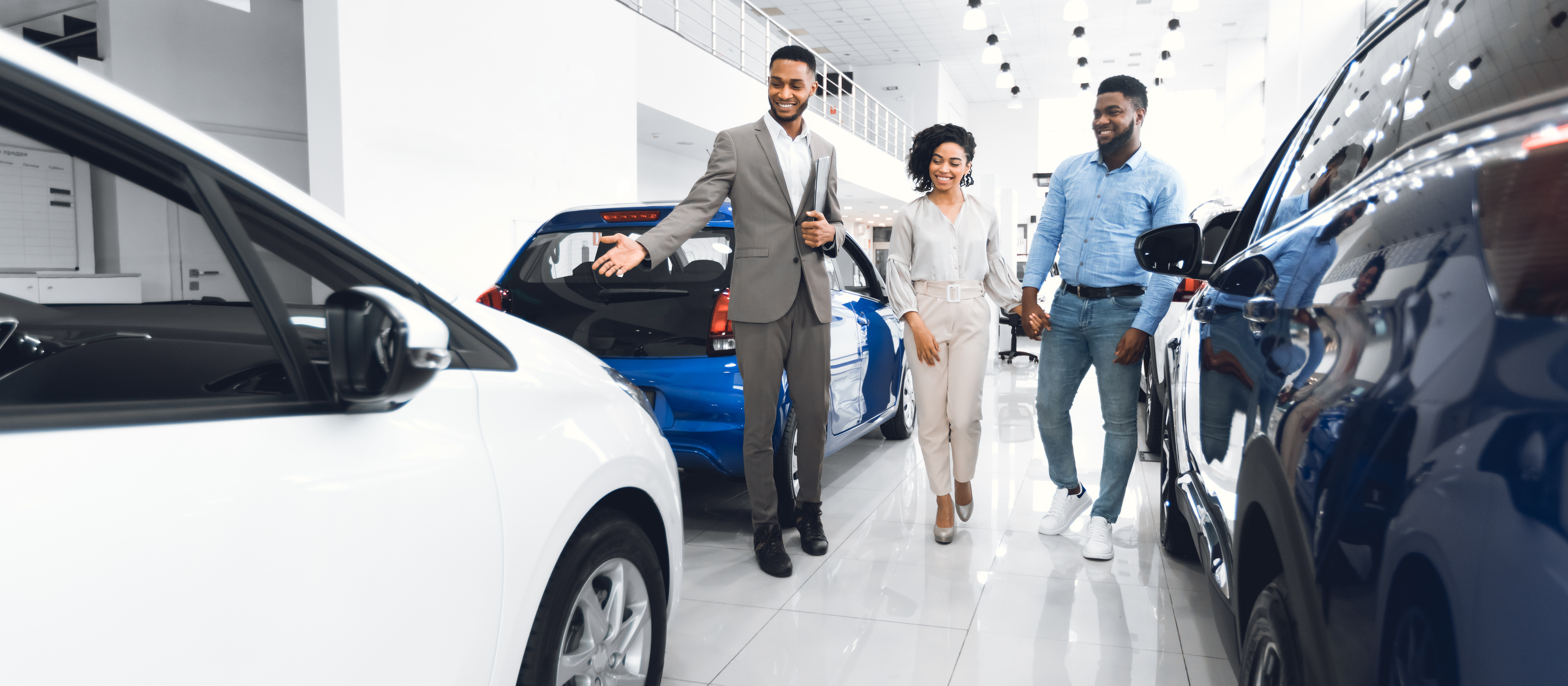 People browsing auto dealership